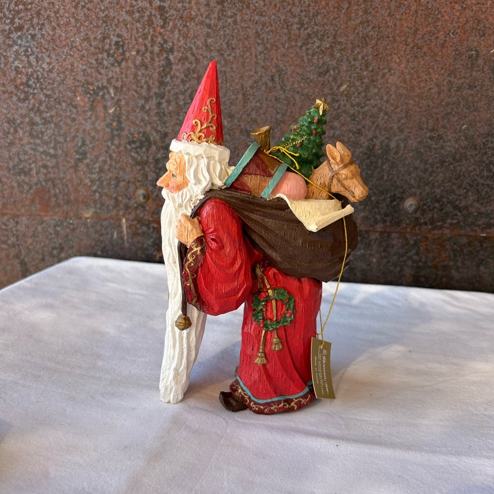 Rare 8 inches tall Santa Claus carrying Bag of Gifts.